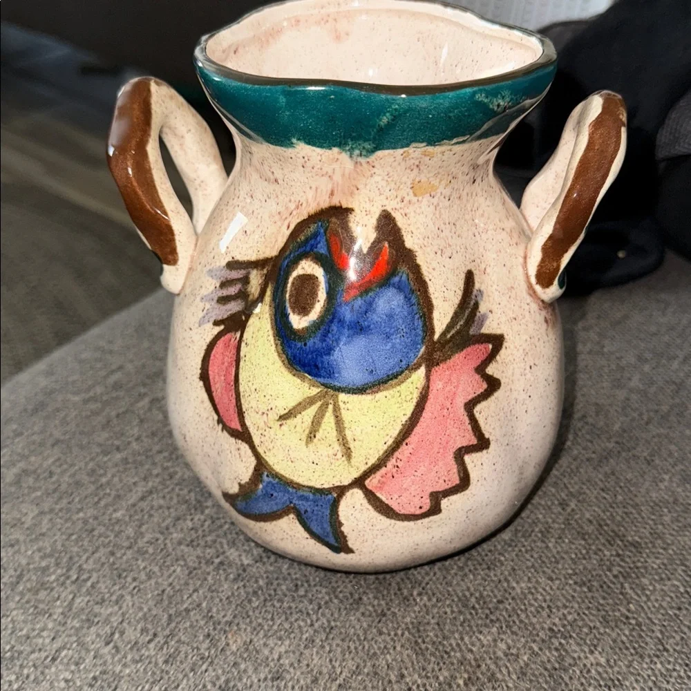 This is a vintage hand-painted ceramic pitcher 1976